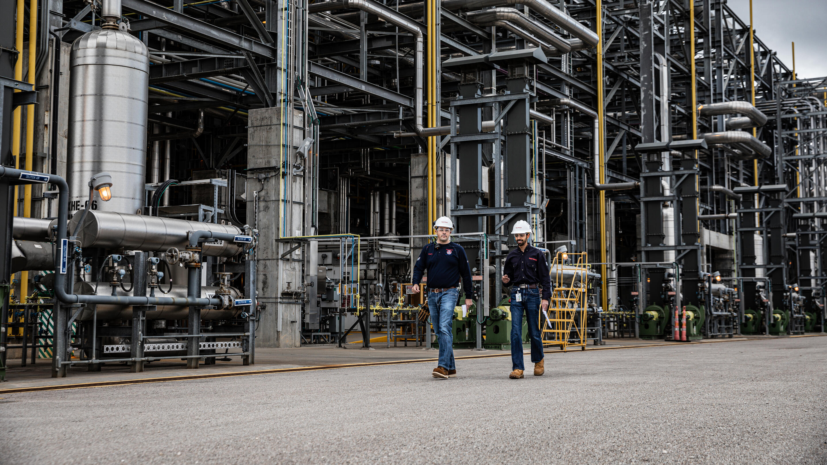 ExxonMobil employees walking in the Baytown, Texas refinery.