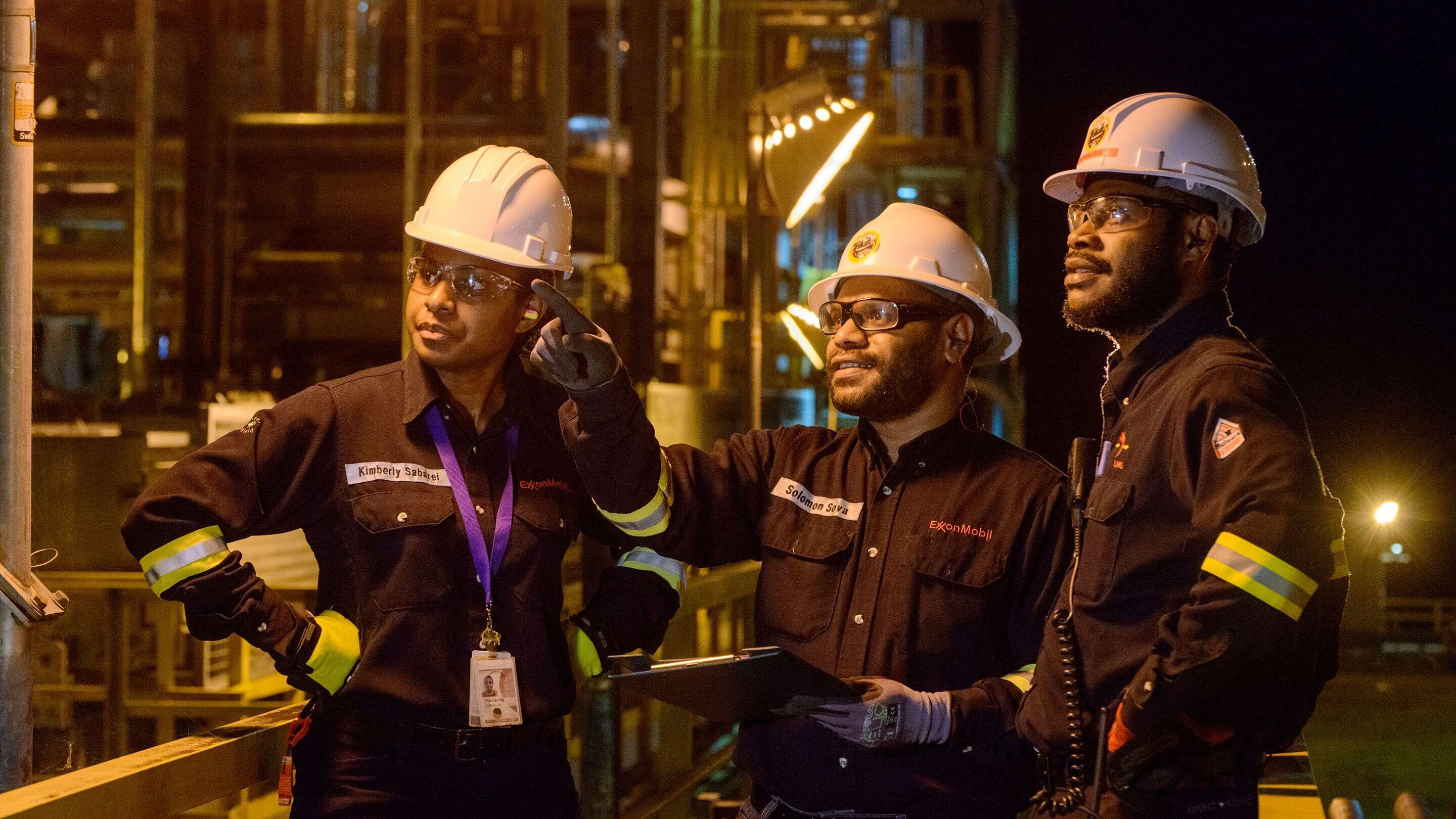 ExxonMobil employees working at night