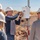 Employees installing ground based sensors.