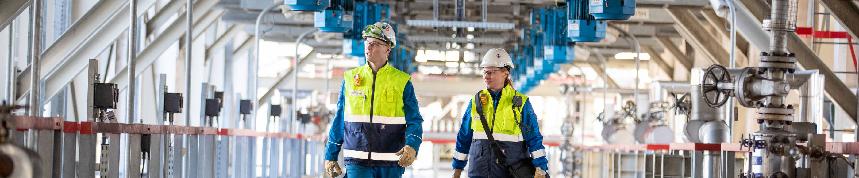 employees walking through the ExxonMobil Antwerp facility