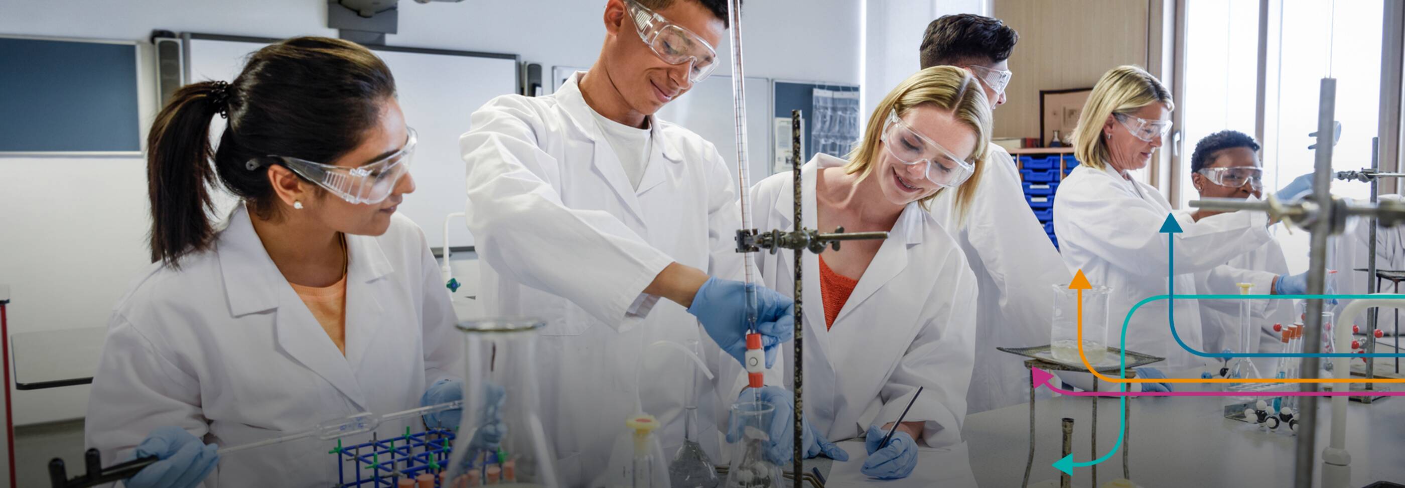 Teachers and students working together in science lab