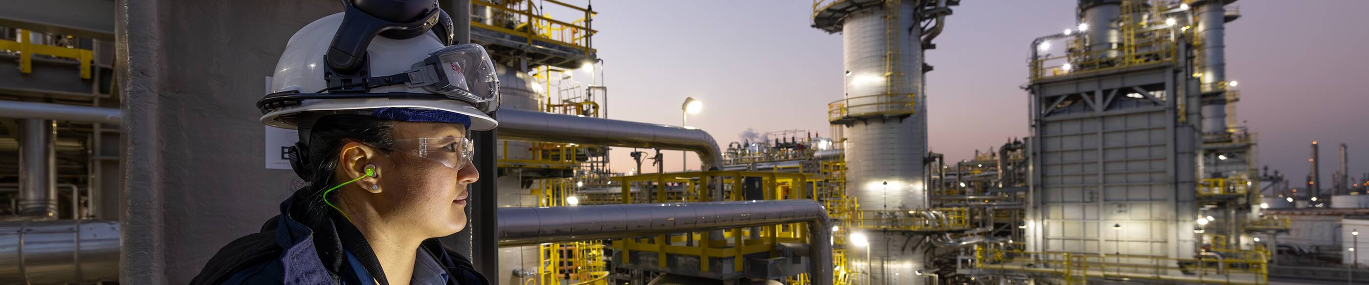 Employee overlooking refinery