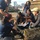 Students sitting in the bay learning about oysters.