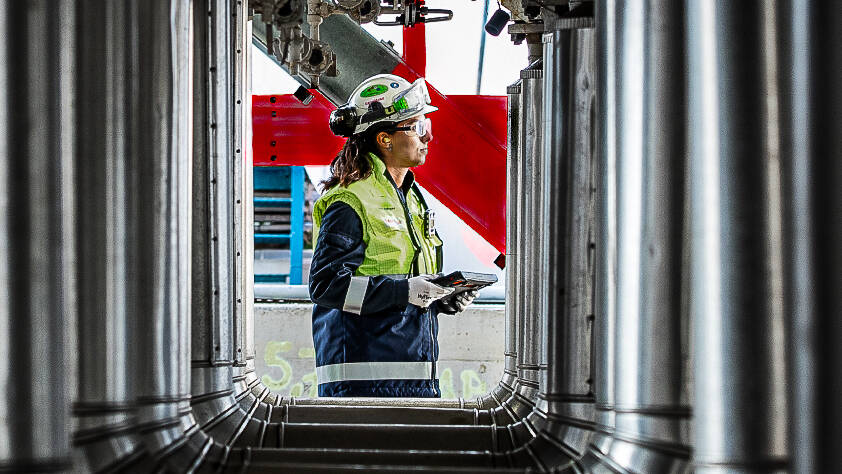Rotterdam refinery worker amongst pipelines