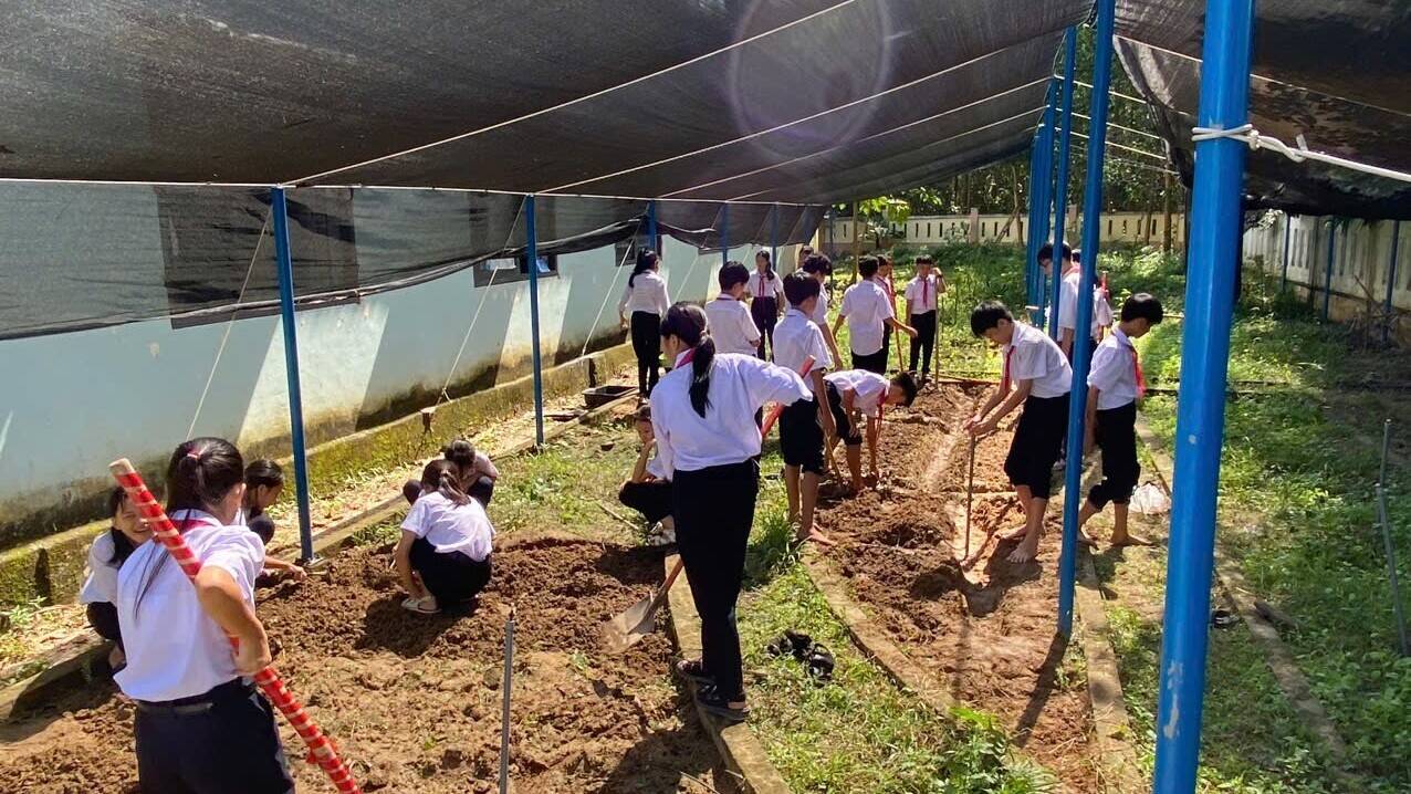 Students participate in STEM activities at the school garden