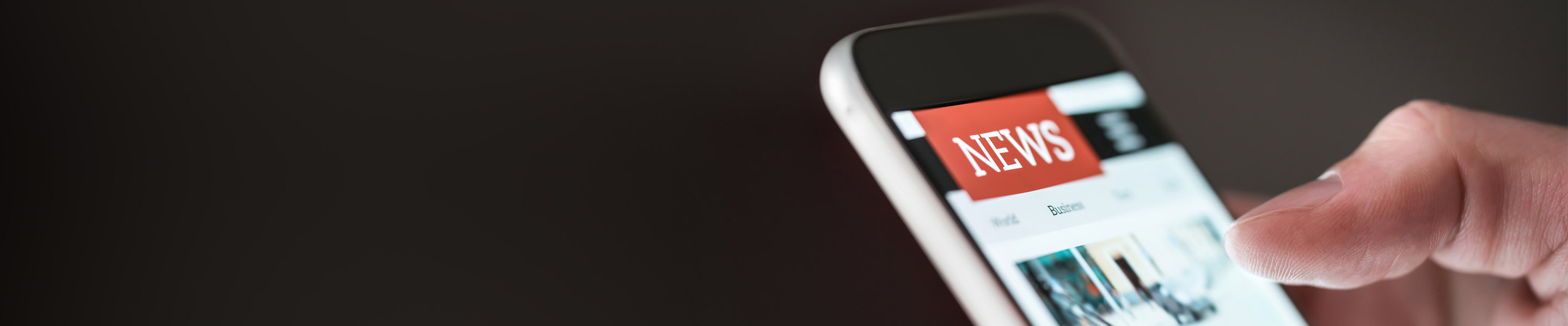 news being viewed on handheld mobile device