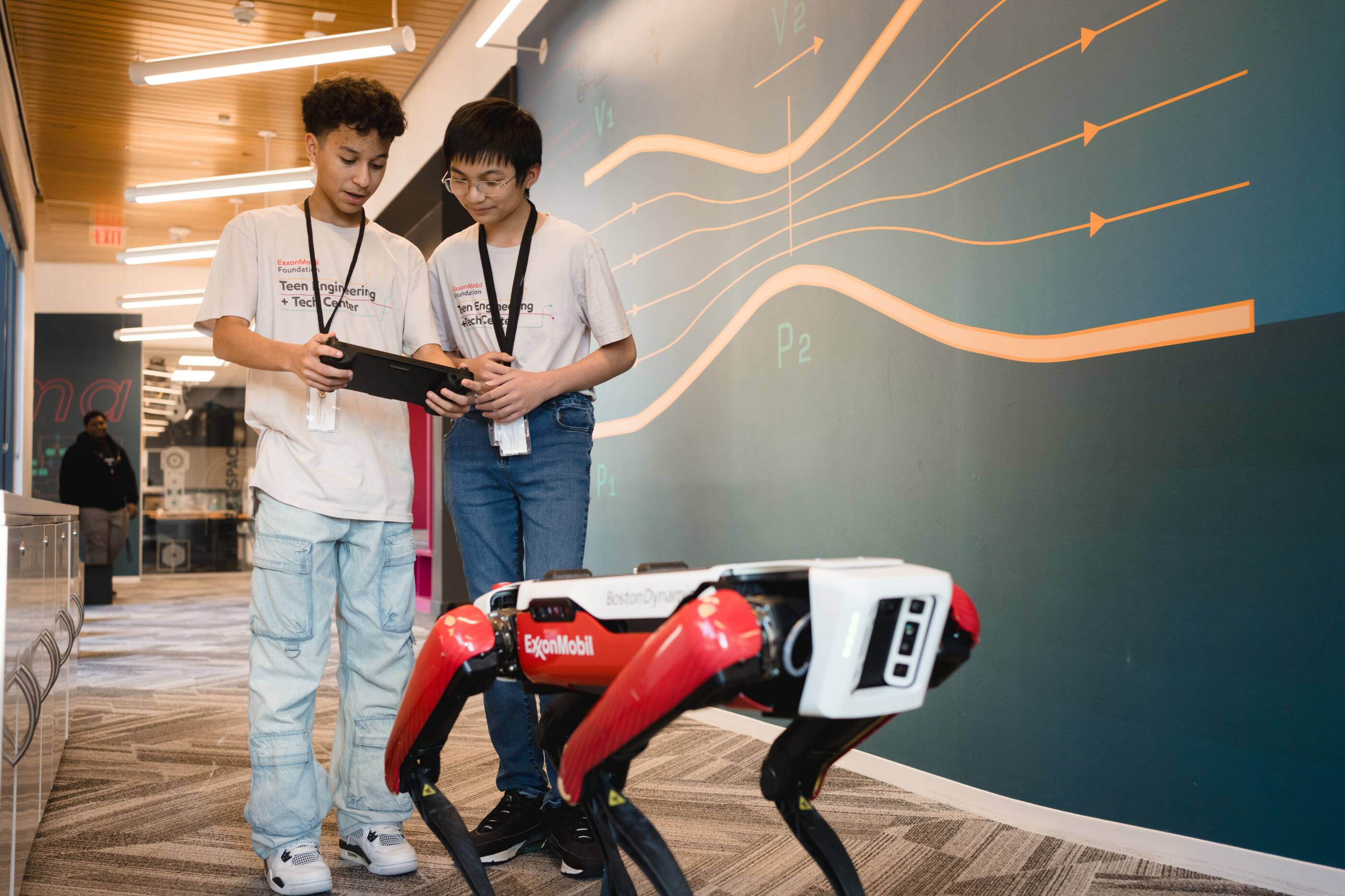 STEM students working with a robot